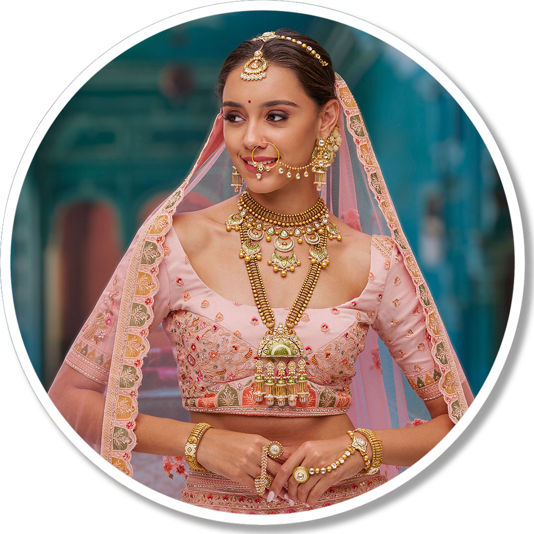 Stunning Bride in Peach Wedding Lehenga and Gold Jewelry